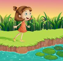 A small girl at the riverbank vector