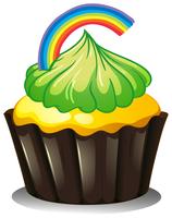 A cupcake with a green icing vector