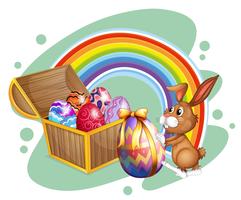 Easter bunny and chest full of eggs vector