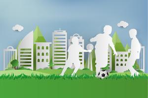 Jugador de fútbol en hierba verde en el parque urbano de la ciudad. estilo de arte de papel. vector