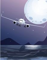Un avión volando sobre el mar en luna llena vector