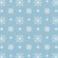 Blue snowflakes pattern. White snowflakes pattern on blue background vector