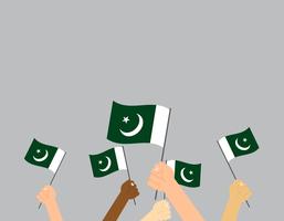 Ilustración vectorial de manos sosteniendo la bandera de Pakistán aislada sobre fondo vector