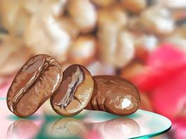 Coffee seed on glass table with coffee blur background vector