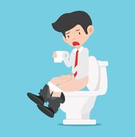 Businessman sitting on White toilet