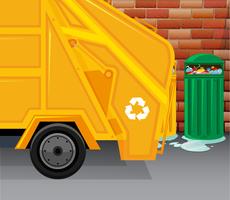 Garbage truck picking up trash vector