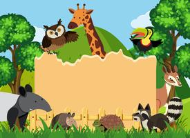 Border template with wild animals in park vector