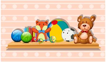 Many cute toys on wooden board vector