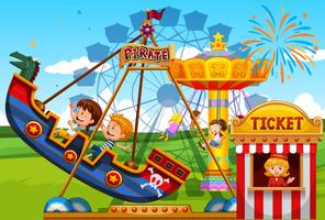 Children playing on rides at the fun park vector