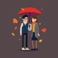 Couple standing together under umbrella