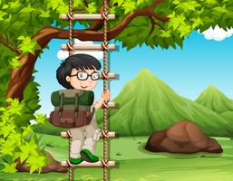 Boy climbing up the wooden ladder in park vector