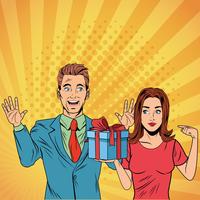 Pop art business couple with present cartoon vector