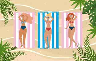 women laying on towels taking sun on the beach vector