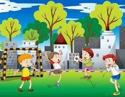 Boys playing soccer in field in city vector