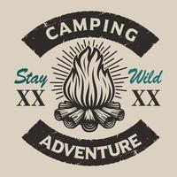 Vintage camping  emblem with a bonfire. vector