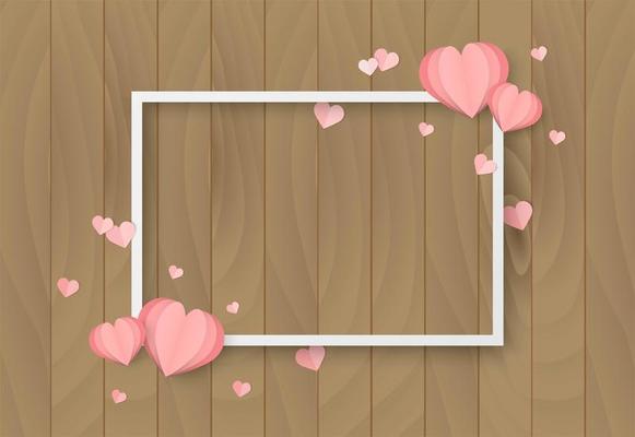 Valentines day wooden background with heart shape and white frame