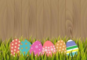 Easter eggs on wooden background vector