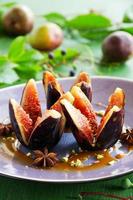 Baked figs with caramel and spices. photo