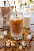 Iced coffee in tall glass photo