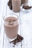 Chocolate Milk (on wooden background) photo