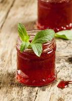 Delicious homemade strawberry jam in a jar, selective focus photo