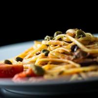 Plate of cooked savory Italian spaghetti photo