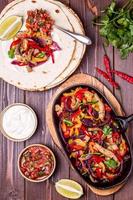 Pork fajitas with onions and colored pepper, served with tortill