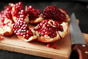 Delicious pomegranate fruit on cutting board