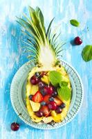 Fruit salad in pineapple photo