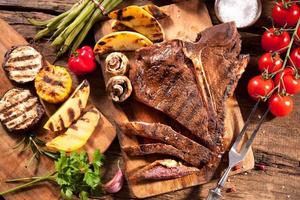 Beef steaks with grilled vegetables photo