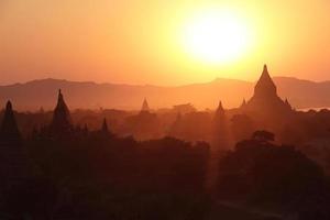silhouettes of ancient Buddhist Temples photo