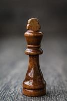 Black King, Chess Piece on a Wooden Table