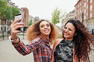Two beautiful young women taking a picture together photo
