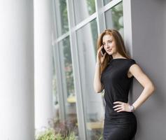 Young woman in front of office