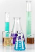 Lab equipment, glassware kit filled with colored liquids, gels photo