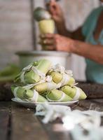 Woman making tamales in Cuba photo