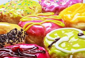 Glazed donuts in the range of background photo