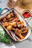 Spicy chicken legs with herbs and sauce