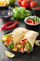 mexican tortilla wrap with chicken breast and vegetables photo