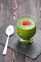 Green Detox smoothie with spinach, kiwi and raspberries. Super Foods photo