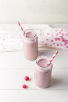 Two bottles of cherry smoothie photo
