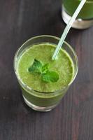 fresh homemade smoothie with spinach and bananas photo