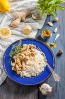 chicken with lemon, curry, ginger and rice photo
