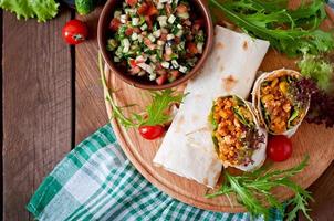 Burritos wraps with minced beef and vegetables photo