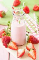 Milk with fresh strawberries photo