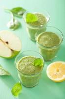 healthy green smoothie with spinach leaves apple lemon