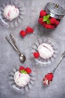 Homemade berry ice cream with fresh raspberries photo