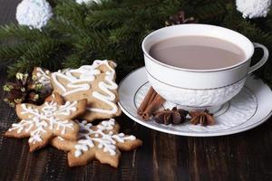Christmas gingerbread cookies and cocoa in a white cup. photo