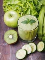 Green smoothie and vegetables photo