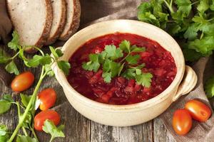 Red soup  borscht  in ceramic  bowl photo